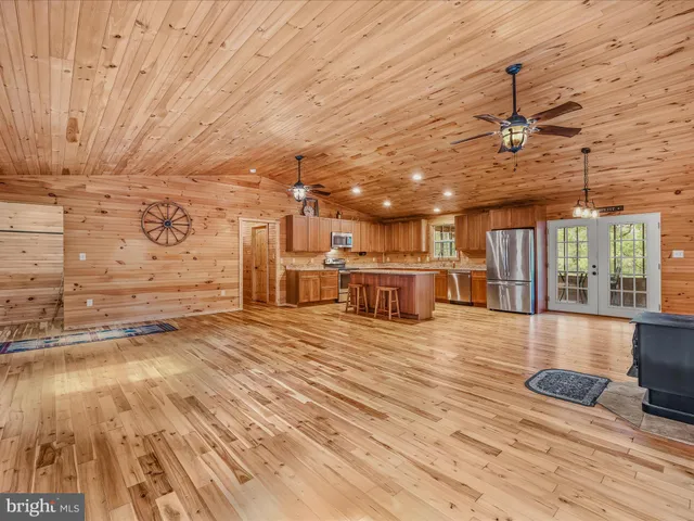 a view of a room with wooden floor