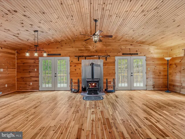 a view of a room with wooden floor