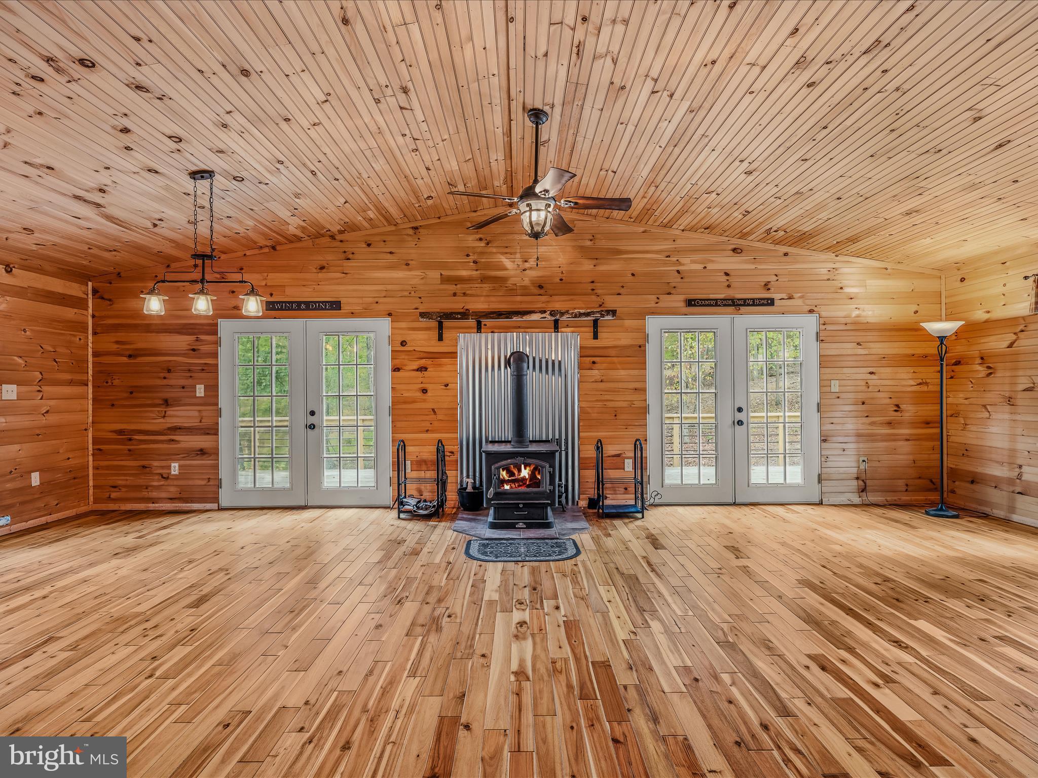 79 Whiskey Still Road Berkeley Springs, WV 25411 - Photo 13 of 59 a view of a room with wooden floor