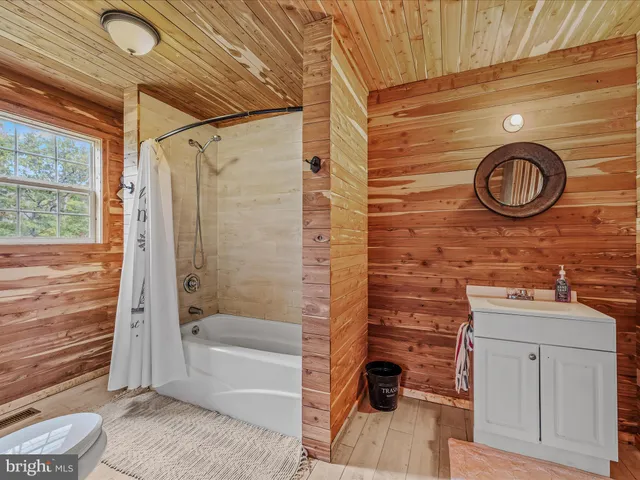 a view of a field with trees in the background