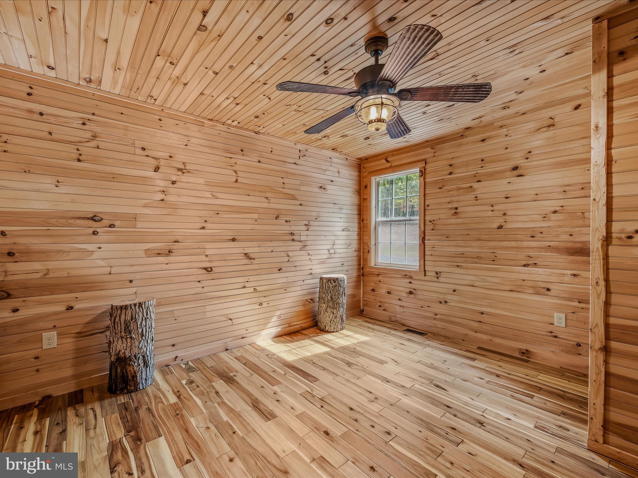 79 Whiskey Still Road Berkeley Springs, WV 25411 - Photo 29 of 59 a bathroom with a wooden floor and a sink