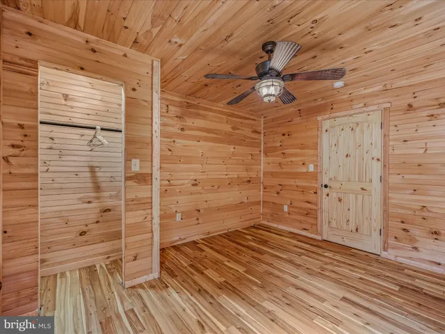 a bedroom with a bed and a walk in closet