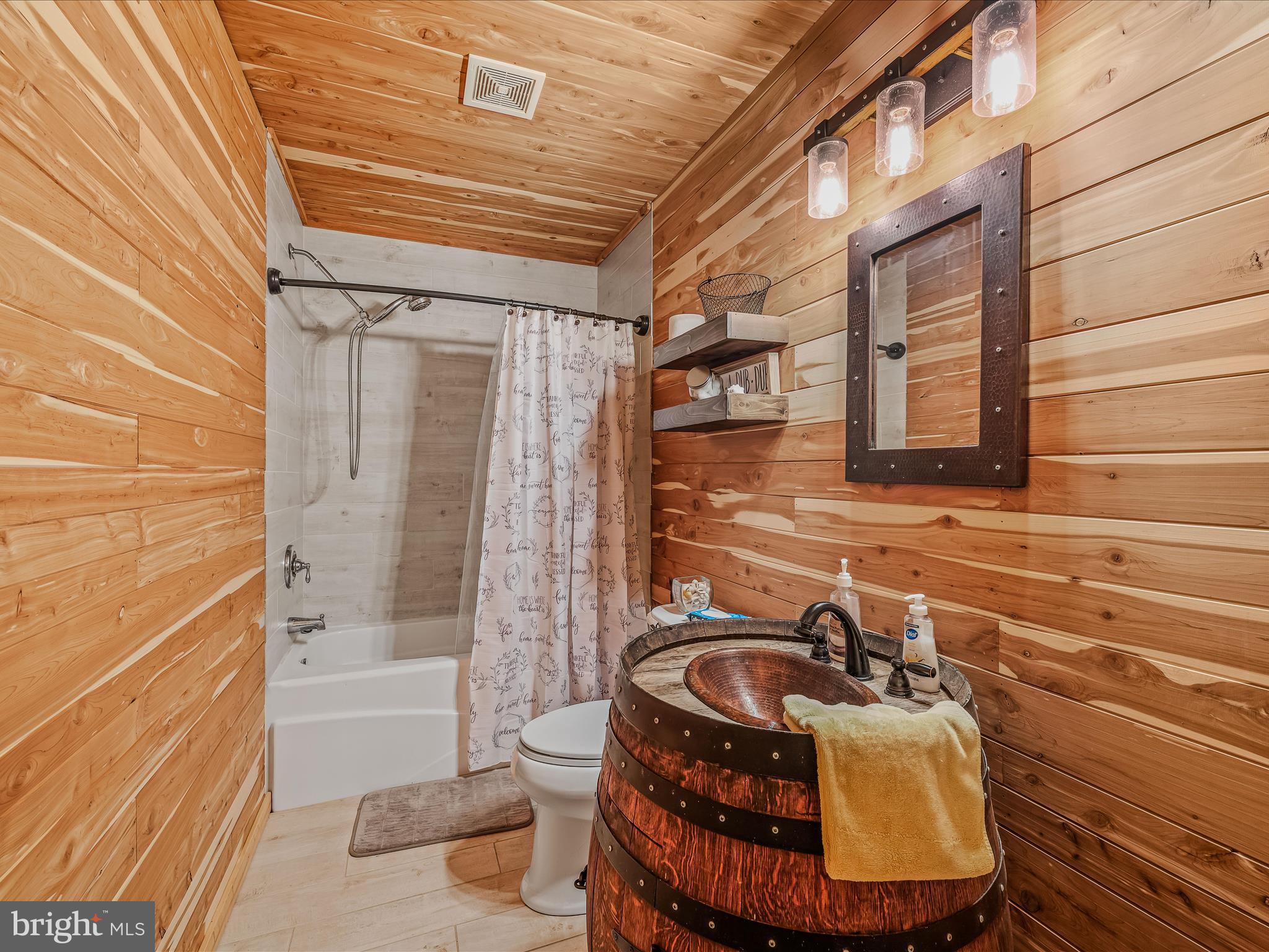 79 Whiskey Still Road Berkeley Springs, WV 25411 - Photo 31 of 59 a bathroom with a sink and a mirror