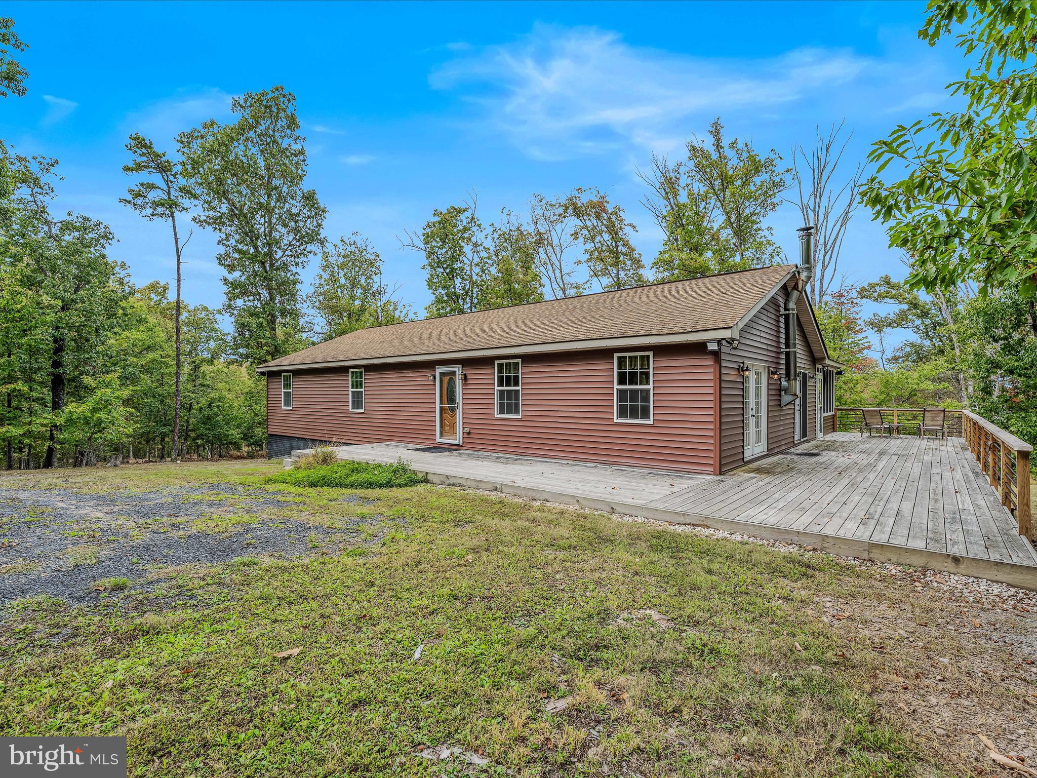 79 Whiskey Still Road Berkeley Springs, WV 25411 - Photo 41 of 59 a view of a backyard of the house