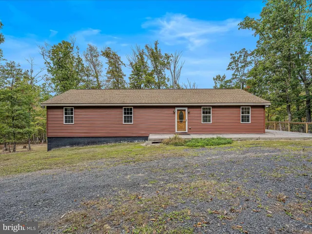 a view of a city with lush green forest