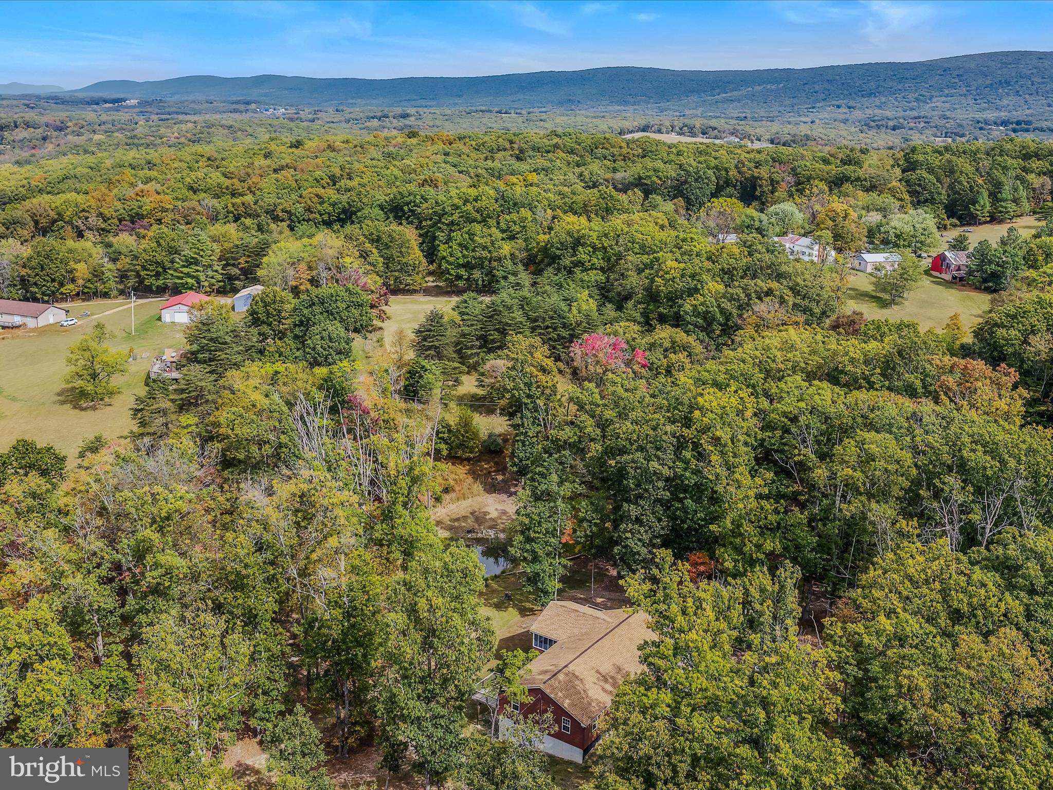 79 Whiskey Still Road Berkeley Springs, WV 25411 - Photo 50 of 59 a view of a city with lush green forest