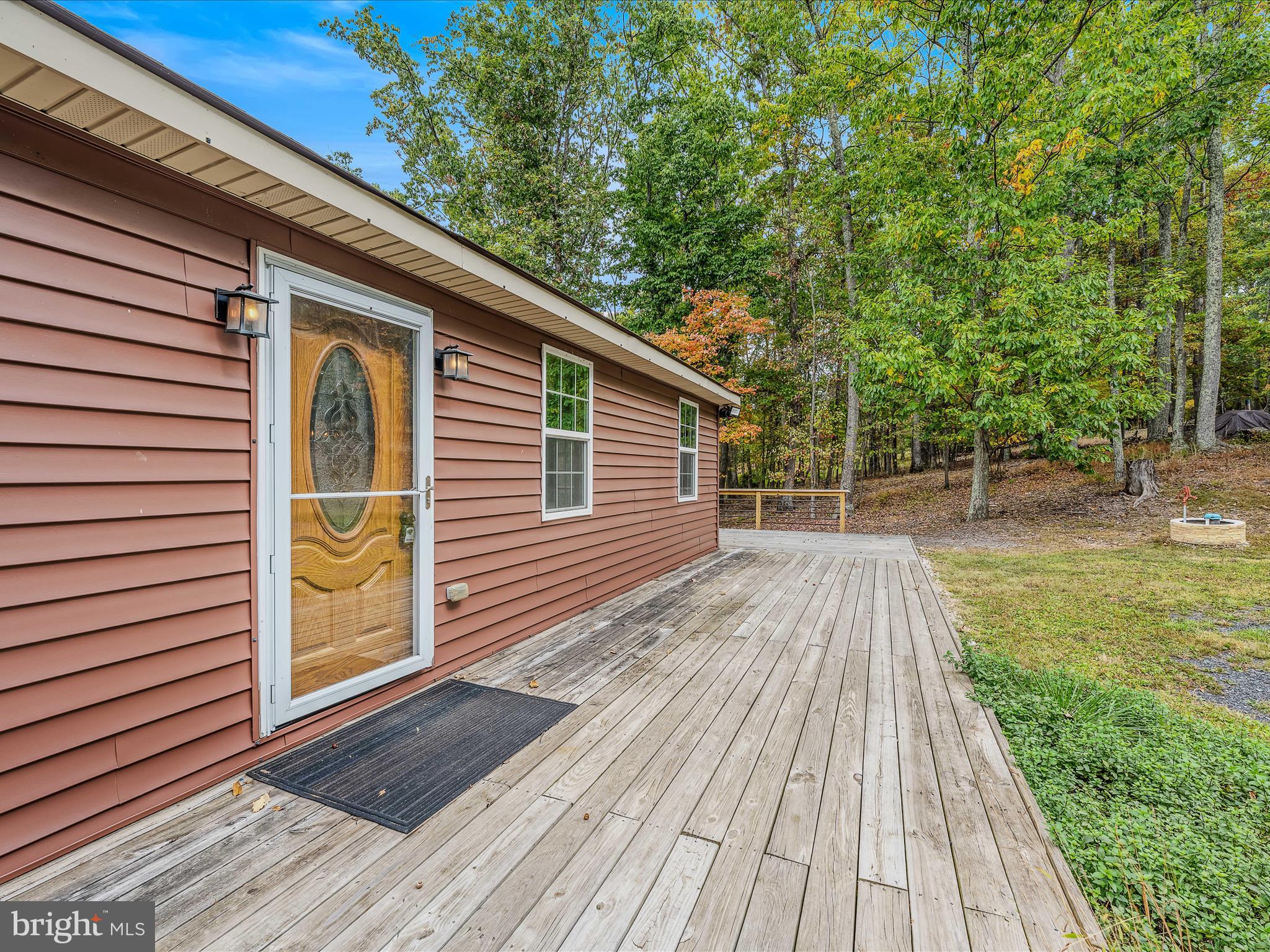 79 Whiskey Still Road Berkeley Springs, WV 25411 - Photo 5 of 59 a view of backyard with a deck