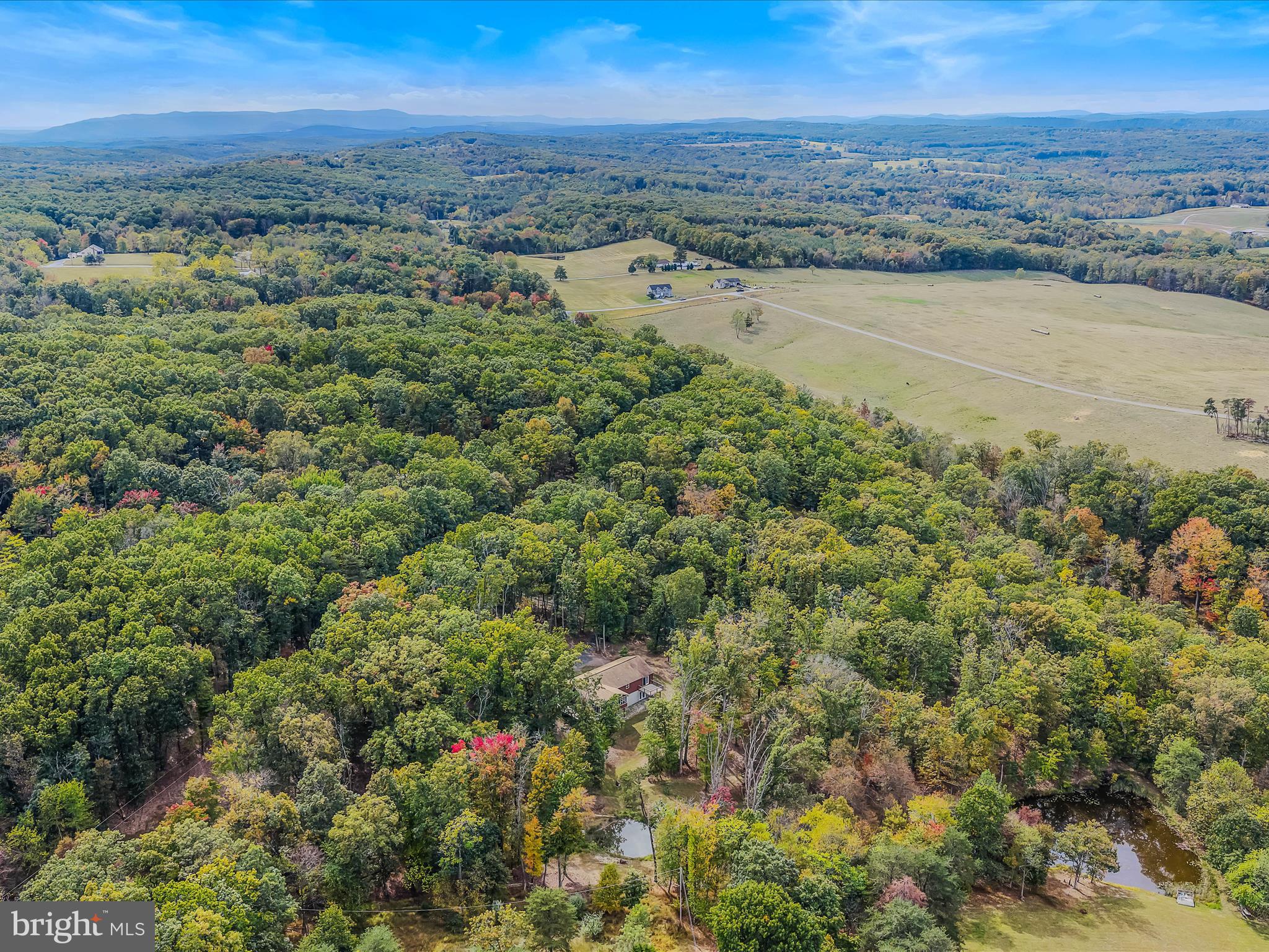 79 Whiskey Still Road Berkeley Springs, WV 25411 - Photo 54 of 59 an aerial view of beach and city