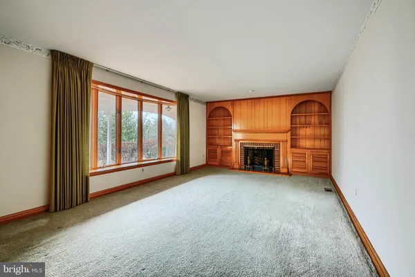 a view of a hardwood floor and wardrobe