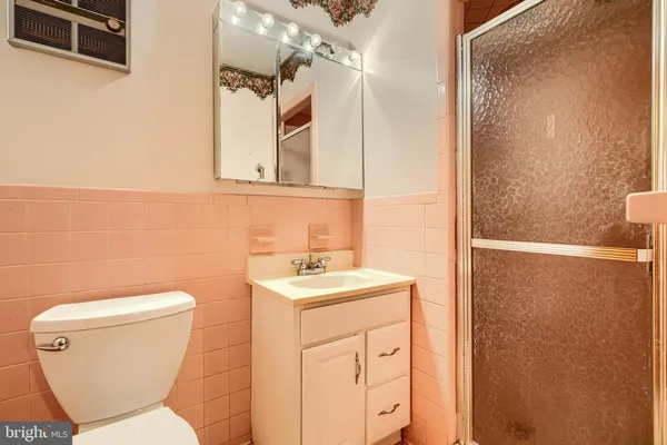 a bathroom with a sink a mirror and a shower