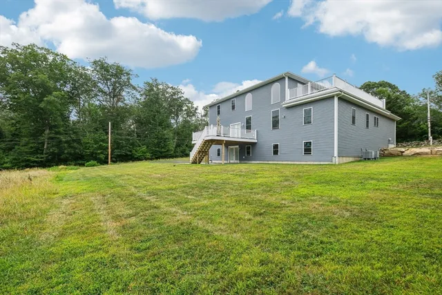 a front view of a house with yard