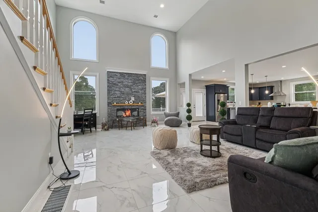 a living room with furniture and a fireplace