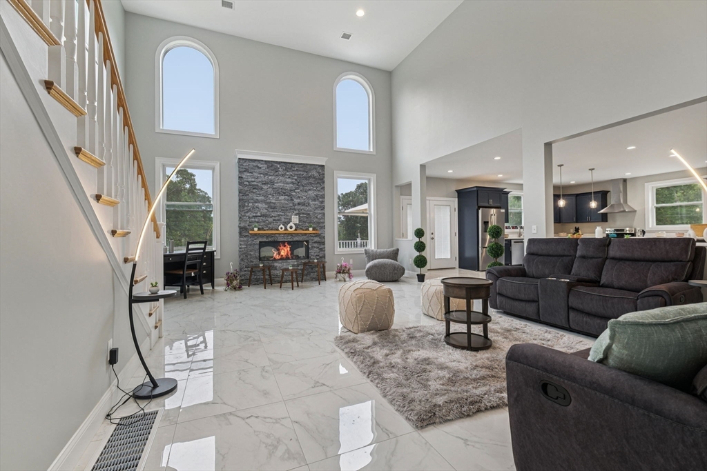 920 Drift Road Westport, MA 02790 - Photo 16 of 41 a living room with furniture and a fireplace