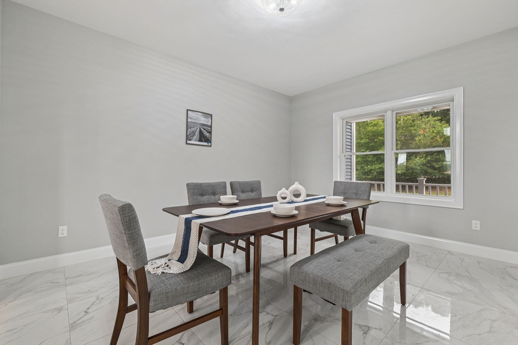 920 Drift Road Westport, MA 02790 - Photo 22 of 41 a view of a dining room that has a table and chairs in it