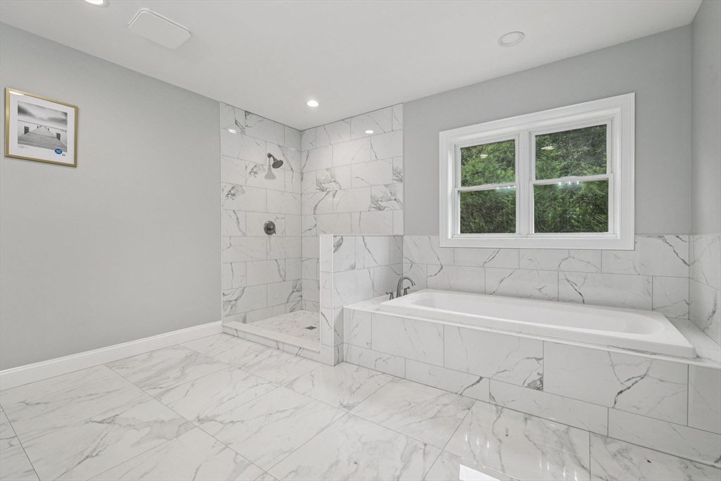 920 Drift Road Westport, MA 02790 - Photo 26 of 41 a spacious bathroom with a bathtub and a shower