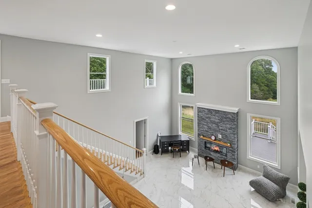 a dining room with furniture and a floor to ceiling window