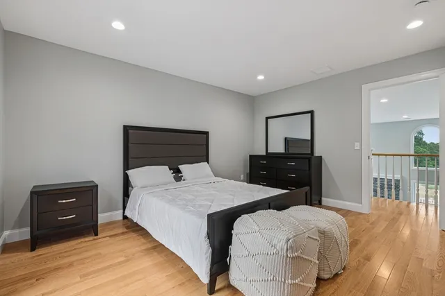 a bedroom with a bed and a tv