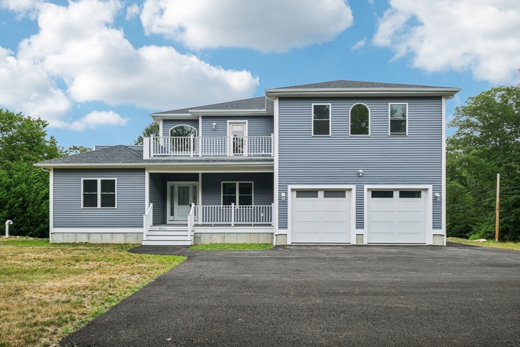 920 Drift Road Westport, MA 02790 - Photo 3 of 41 a front view of a house with a yard