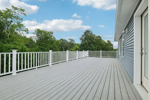 a view of a balcony with wooden floor