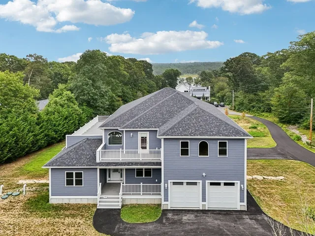 a aerial view of a house with a yard