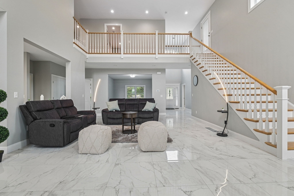 920 Drift Road Westport, MA 02790 - Photo 5 of 41 a living room with furniture a wooden floor and white walls