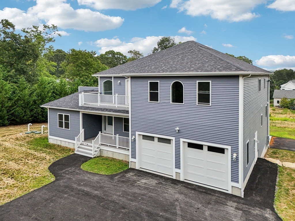 920 Drift Road Westport, MA 02790 - Photo 9 of 41 a front view of a house with a yard