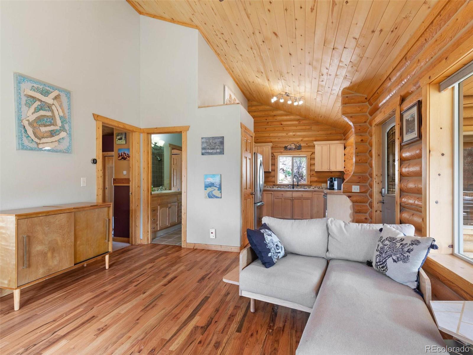 603 Old State Road Bailey, CO 80421 - Photo 11 of 40 a living room with furniture and a wooden floor