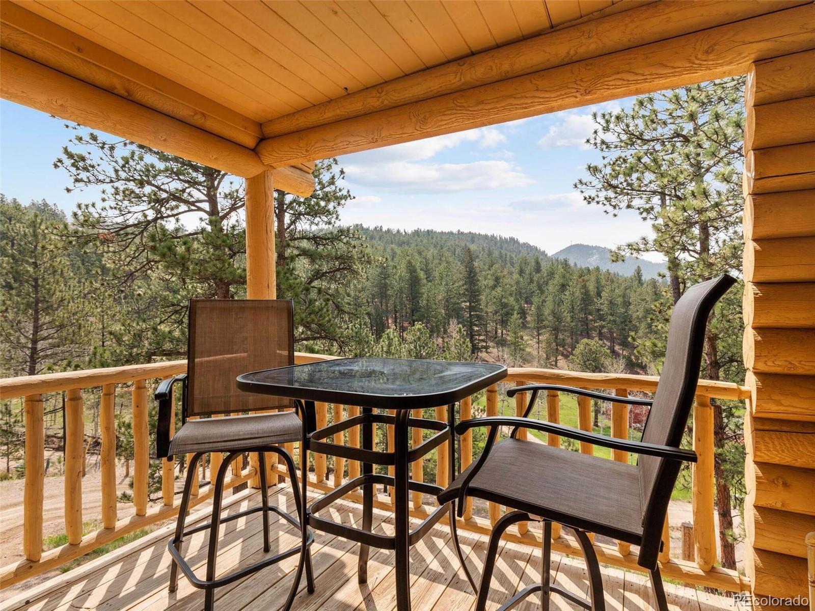 603 Old State Road Bailey, CO 80421 - Photo 19 of 40 a view of a chairs and table in the outdoor