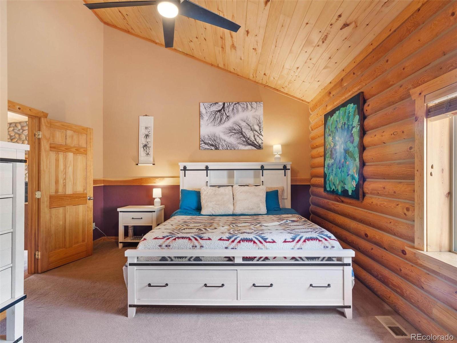 603 Old State Road Bailey, CO 80421 - Photo 21 of 40 a bedroom with a bed and window