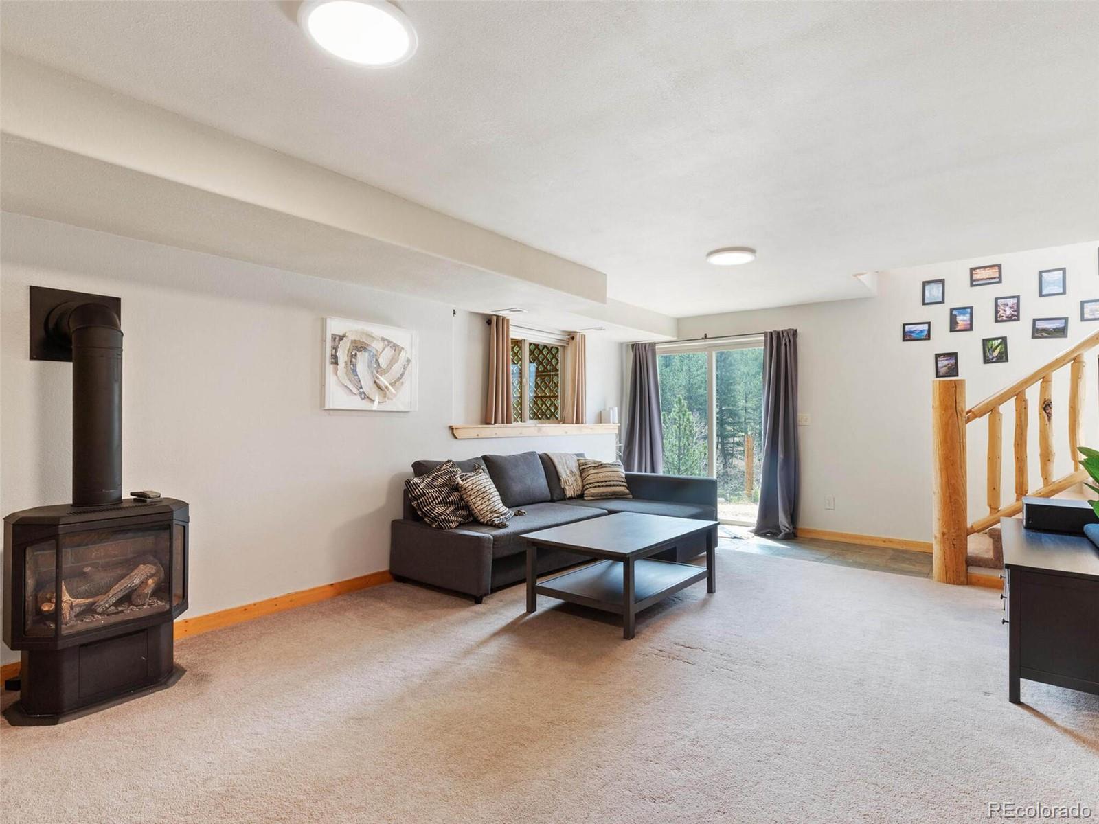 603 Old State Road Bailey, CO 80421 - Photo 30 of 40 a living room with furniture and a window