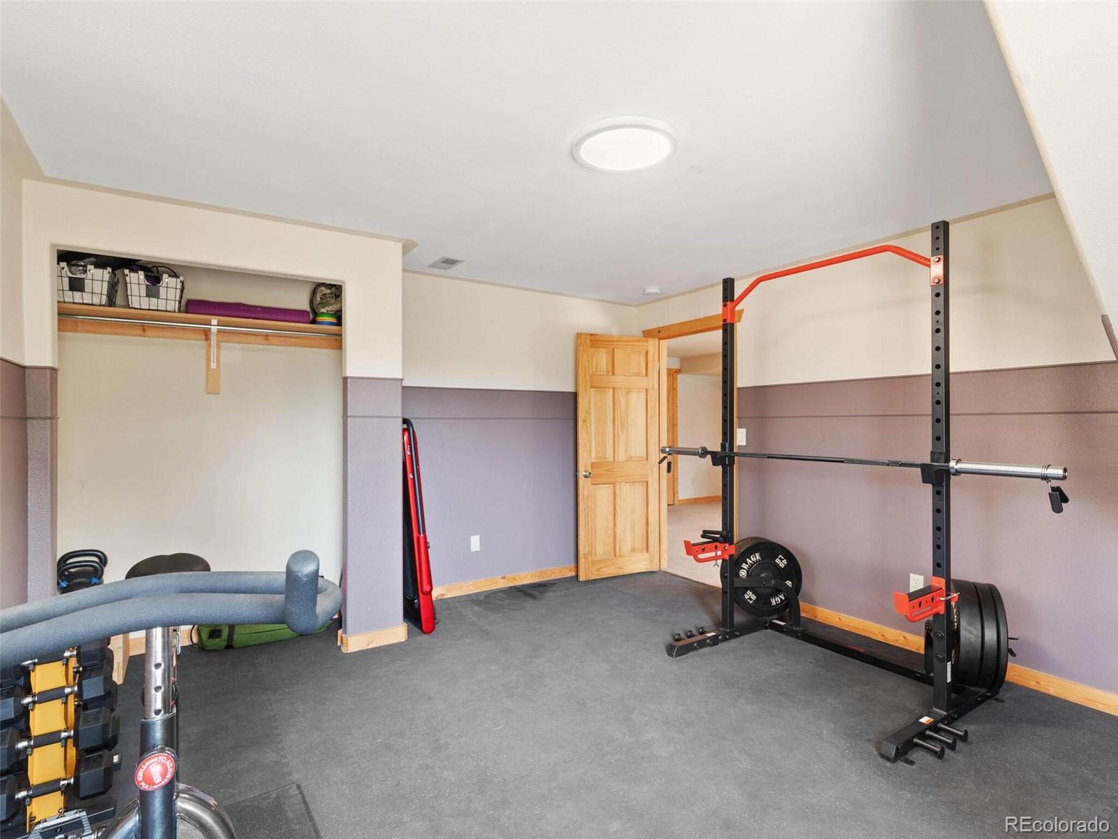 603 Old State Road Bailey, CO 80421 - Photo 33 of 40 a view of a room with gym equipment