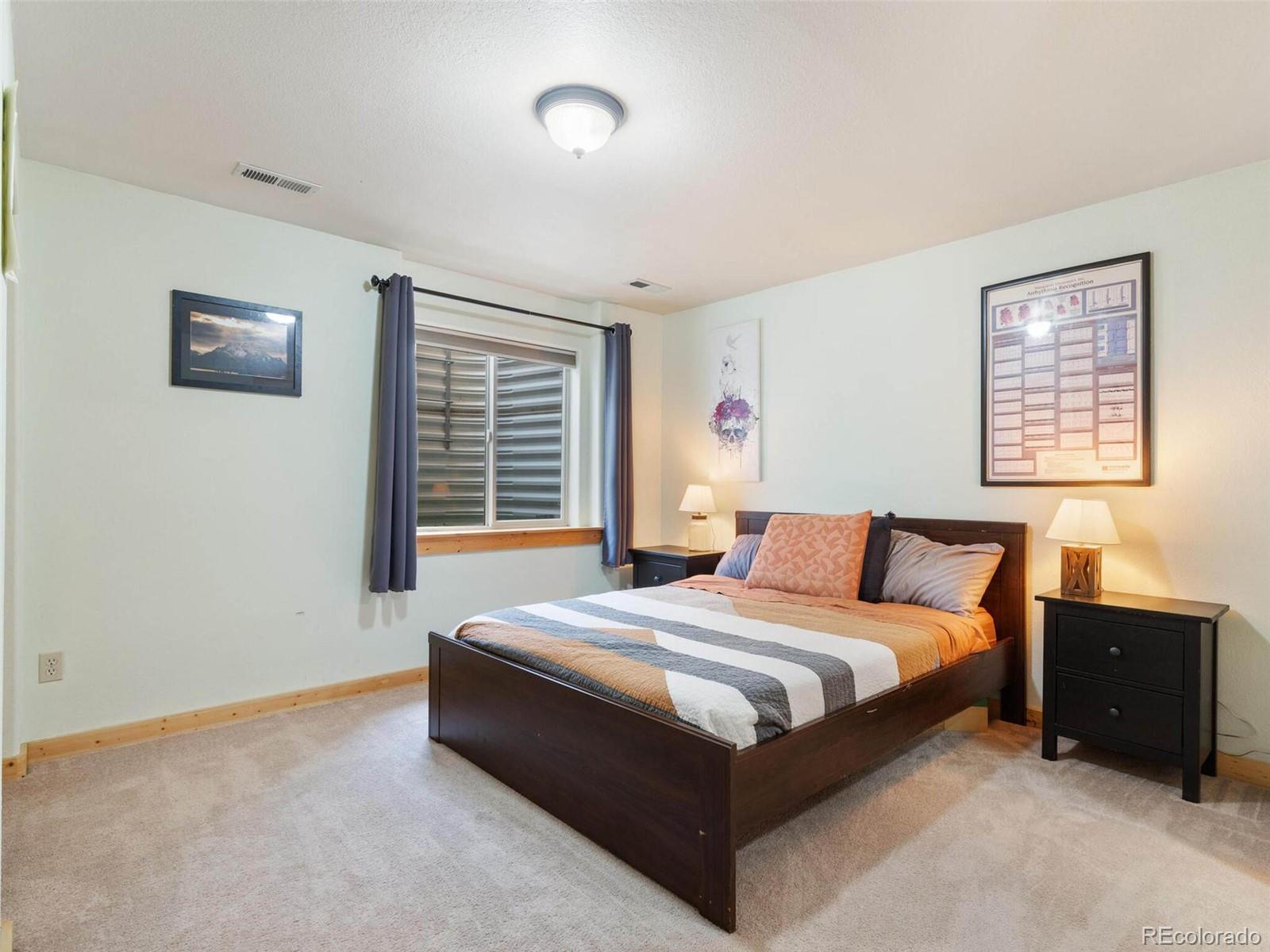 603 Old State Road Bailey, CO 80421 - Photo 34 of 40 a bedroom with a bed and a window