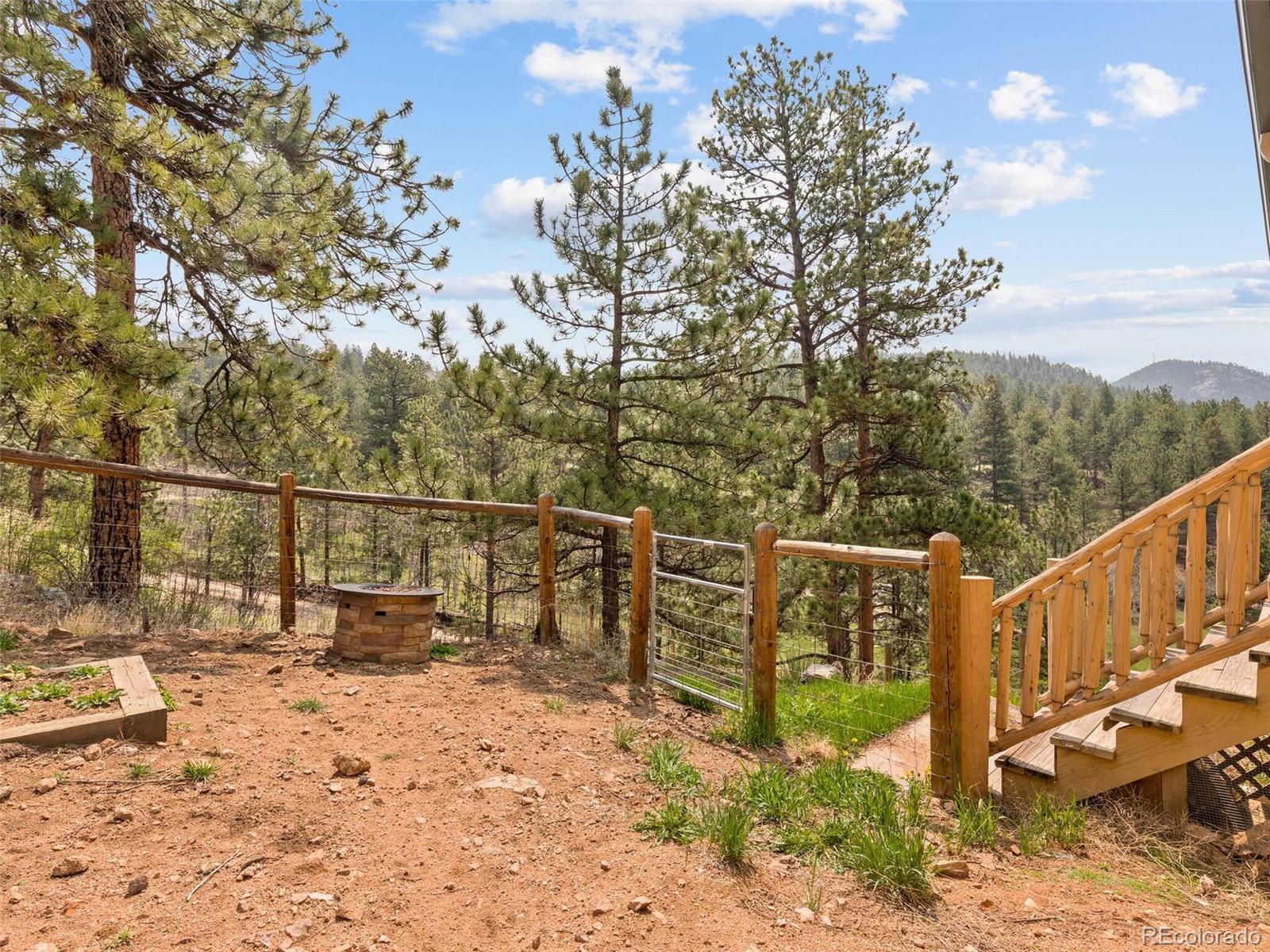 603 Old State Road Bailey, CO 80421 - Photo 40 of 40 a view of a trees and front view of a house