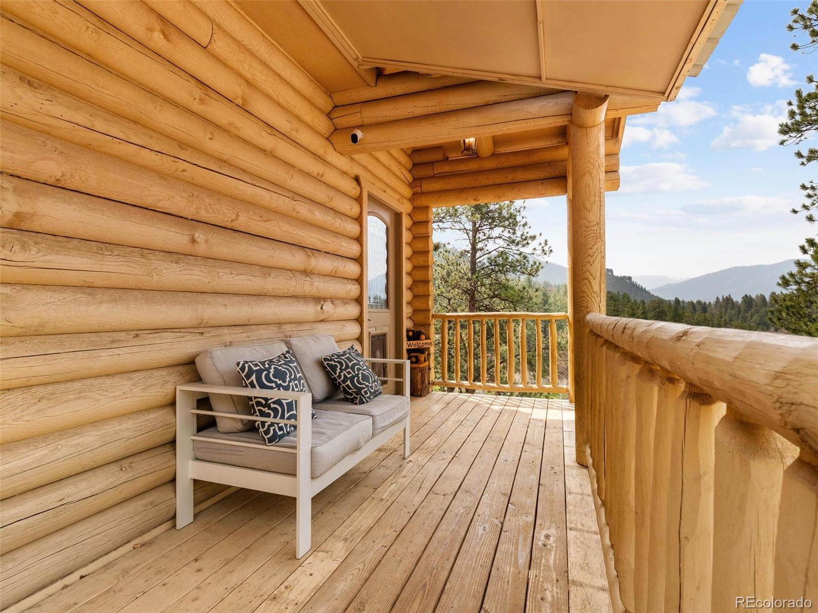 603 Old State Road Bailey, CO 80421 - Photo 4 of 40 a view of a two chairs in the balcony
