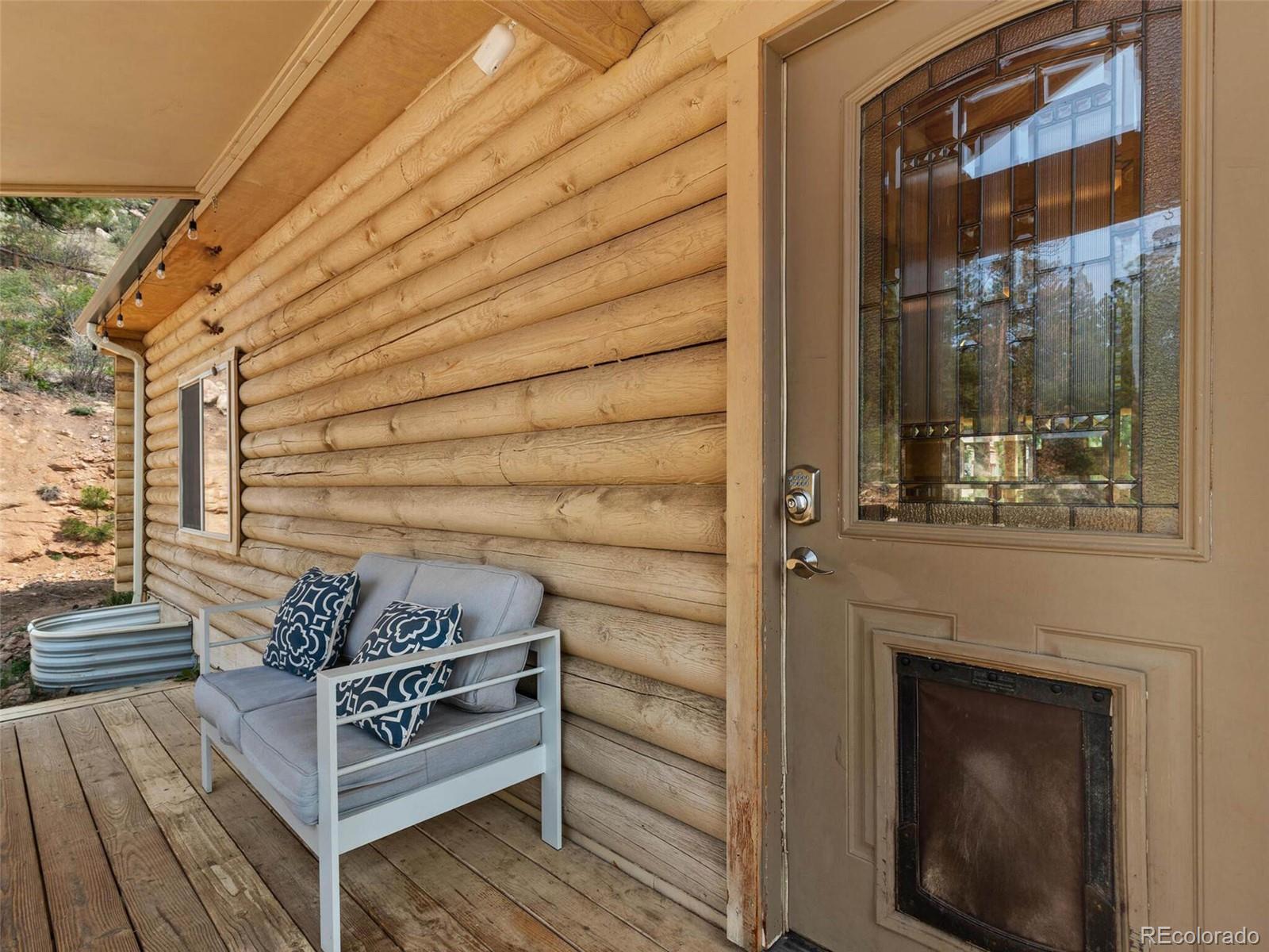 603 Old State Road Bailey, CO 80421 - Photo 5 of 40 a view of a entryway door of the house