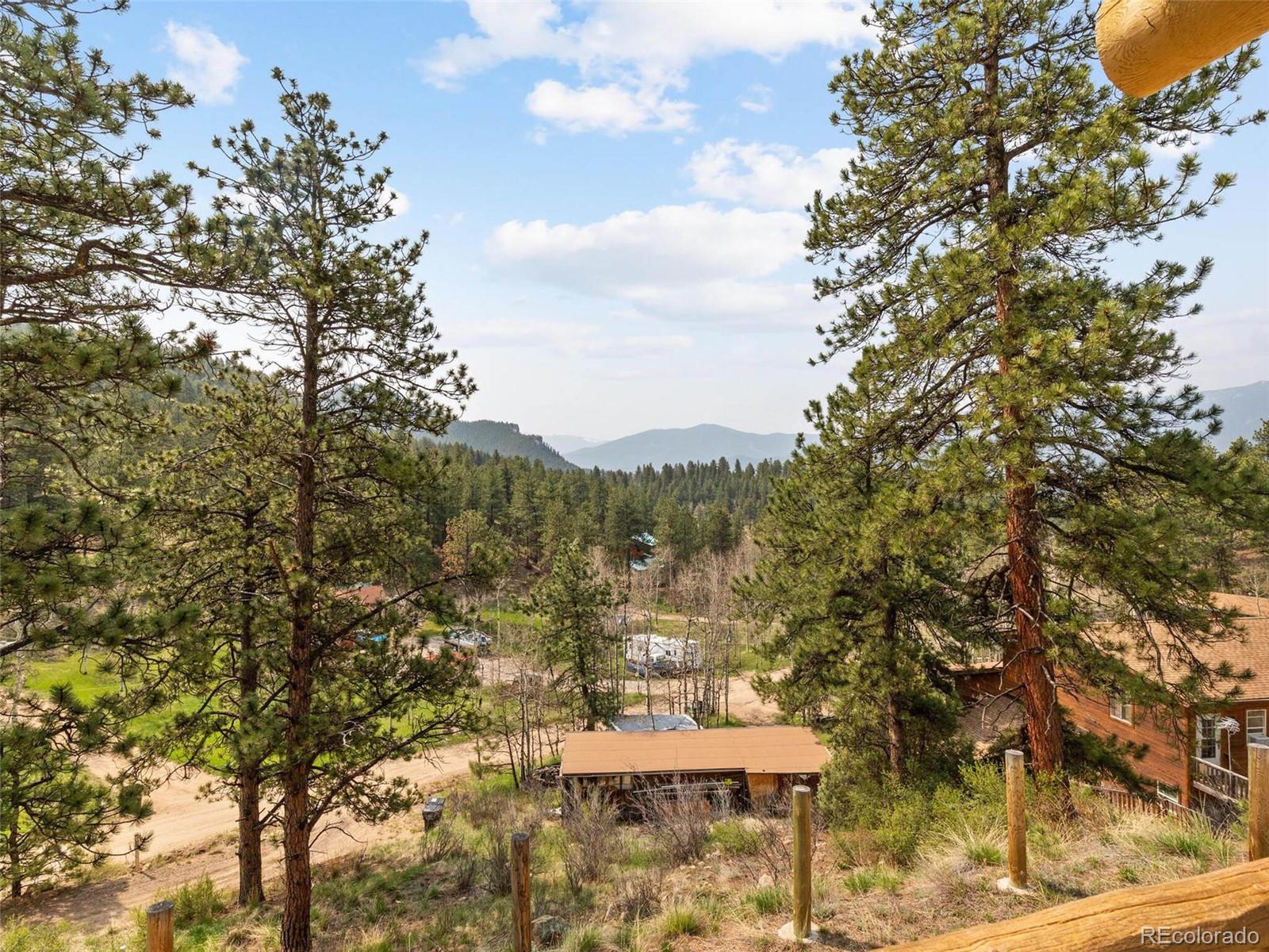 603 Old State Road Bailey, CO 80421 - Photo 6 of 40 a view of a city from a tree