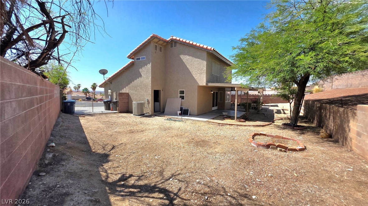2155 Athol Way Laughlin, NV 89029 - Photo 17 of 19 An arid backyard awaits creative landscaping, featuring a patio area for outdoor enjoyment.