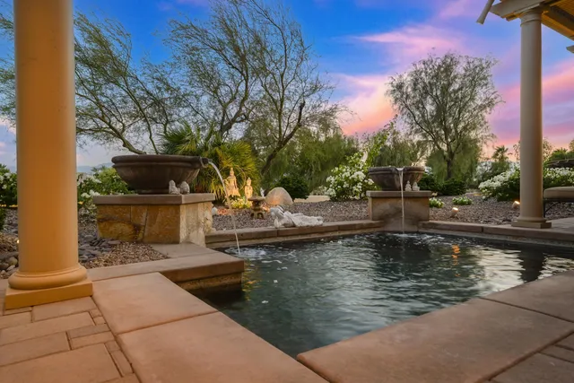 a view of a swimming pool with a patio