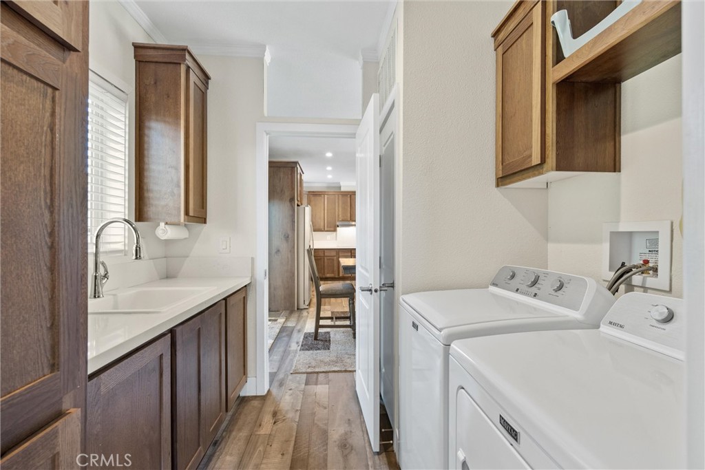 12656 Centerville Road Chico, CA 95928 - Photo 25 of 45 Large Laundry Room With Utility Sink and Numerous Cabinets. Quick and Convenient Access to Dining Room and Kitchen