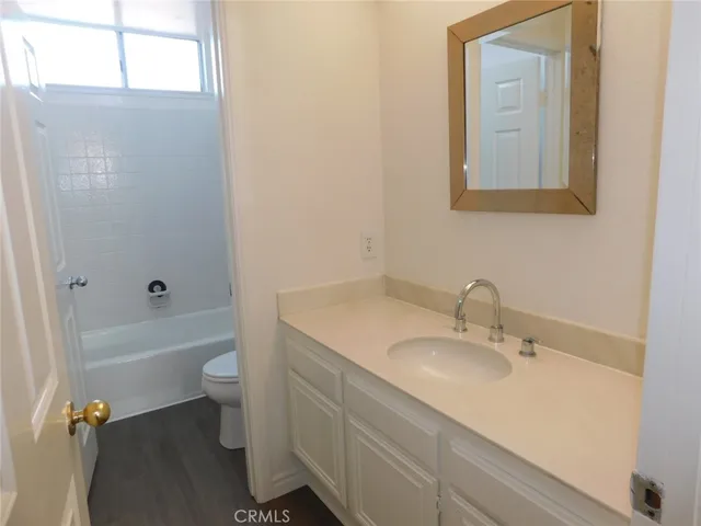 a bathroom with a sink toilet a bathtub and vanity