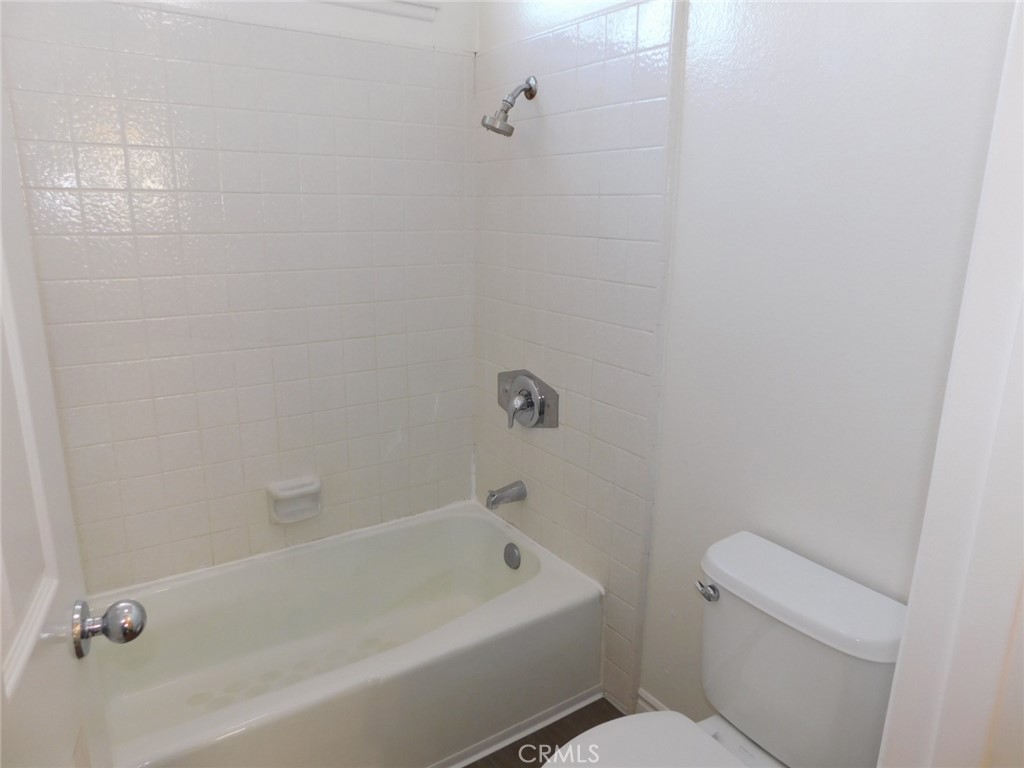 22411 Salmeron Mission Viejo, CA 92691 - Photo 18 of 30 a bath tub sitting next to a white toilet and a sink