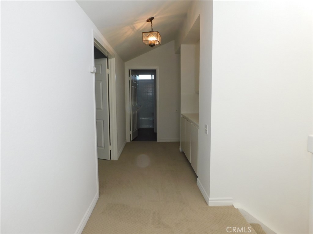 22411 Salmeron Mission Viejo, CA 92691 - Photo 25 of 30 a view of a hallway with chandelier