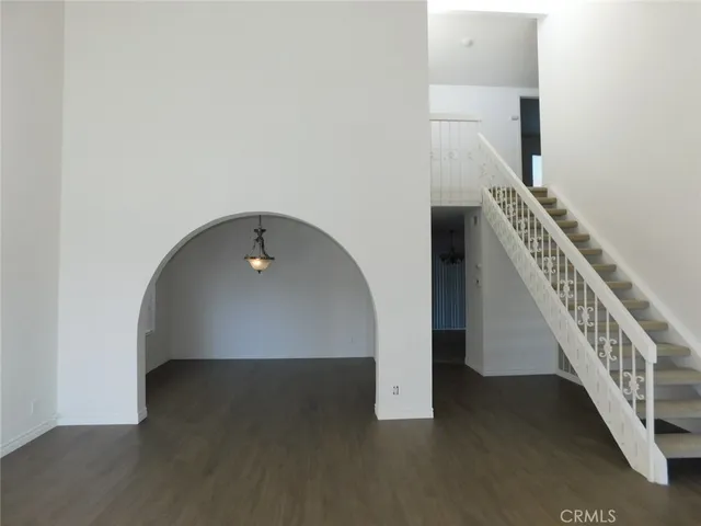 a view of an entryway with wooden floor