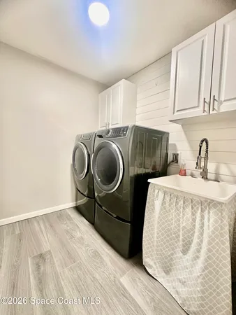 a bedroom with a bed and cabinets