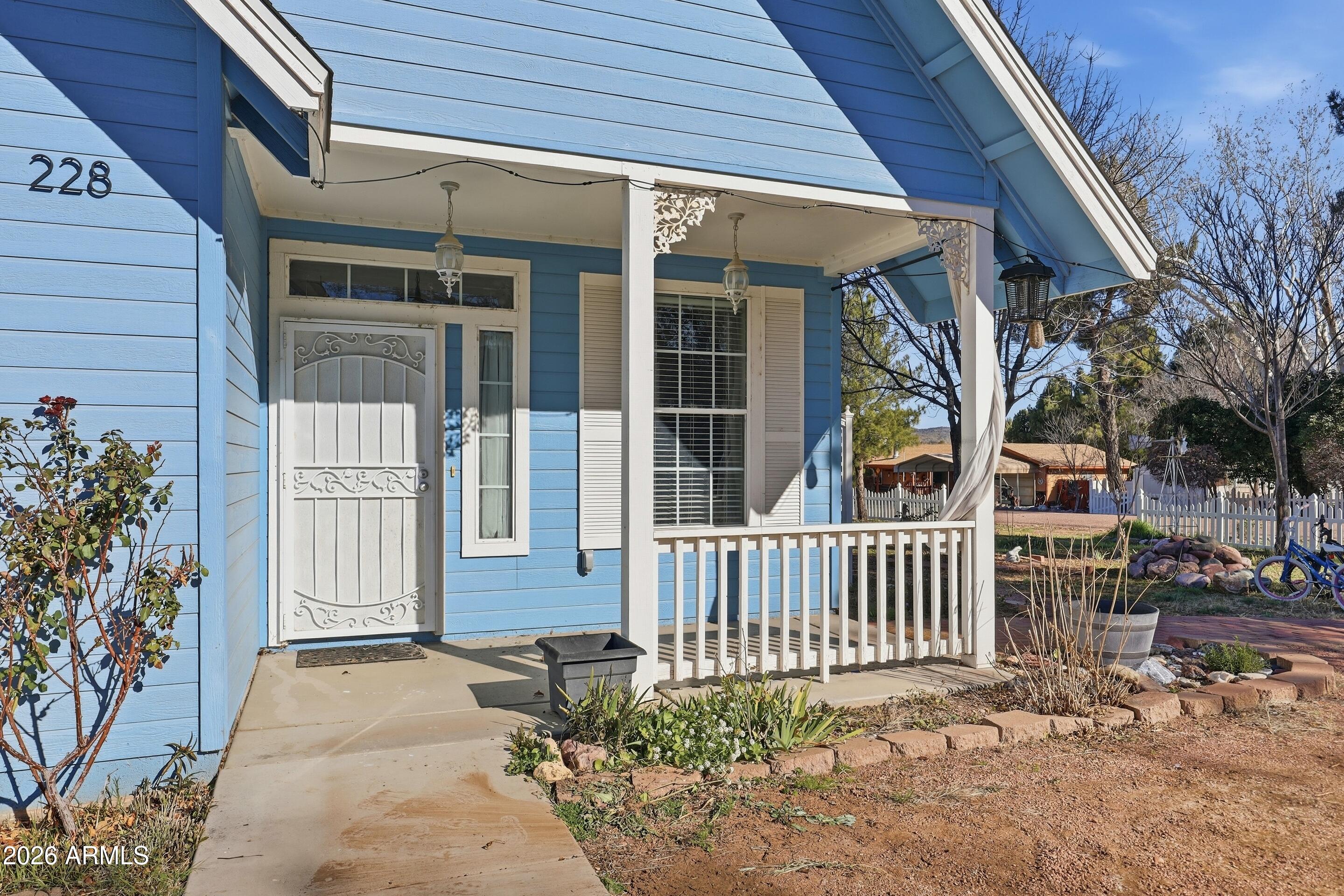 228 Windmill Road Payson, AZ 85541 - Photo 13 of 42 a front view of a house with garden