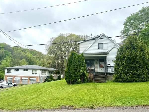 a view of a house with a garden