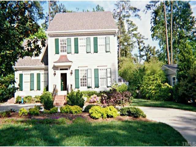 3704 Bellevue Road Raleigh, NC 27609 - Photo 1 of 1 a front view of a house with a yard and potted plants