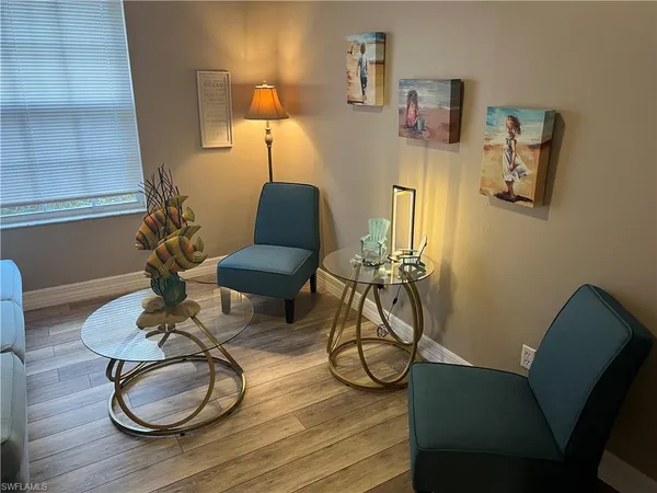 a table room with furniture and wooden floor