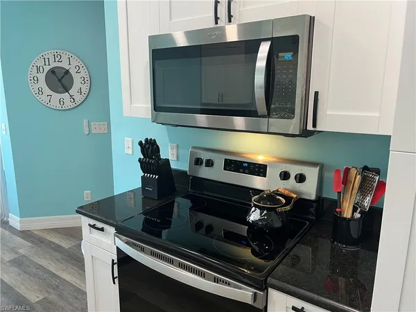 a kitchen with a stove and a microwave