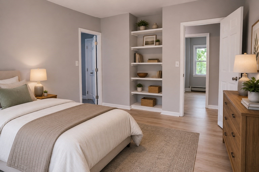 32 Dale Street Franklin, MA 02038 - Photo 6 of 11 a spacious bedroom with a bed and a cabinets